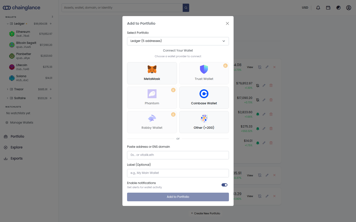 The Add to Portfolio dialog in Chain Glance, offering MetaMask, Trust Wallet, Phantom, Coinbase Wallet and Rabby Wallet as connection options, with a field below to paste an address or ENS domain and an optional label.